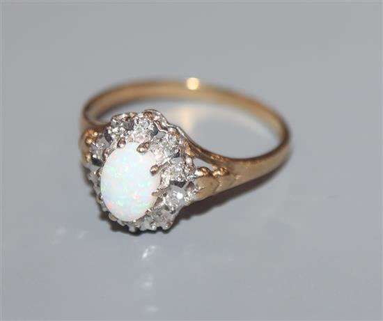 A 9ct gold, white opal and illusion set diamond ring, size P.